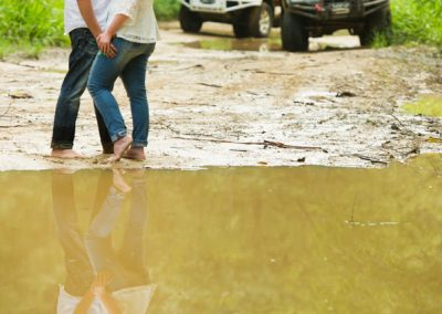 Couple standing by mud pool