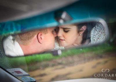 couple in rear vision mirror