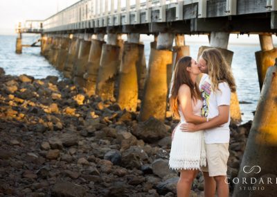 couple kissing on rocks