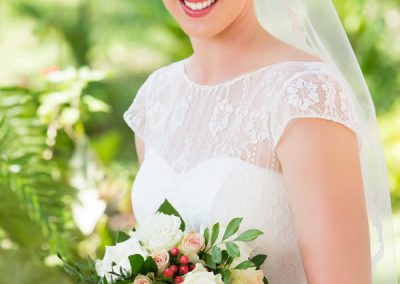 Bride looking at bouquet