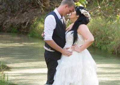 Bride and Groom in stream