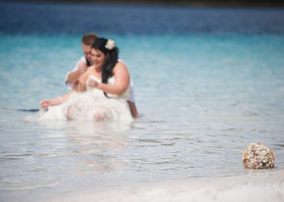 bride and groom in the water