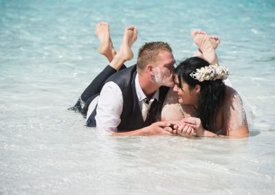 bride and groom in the water